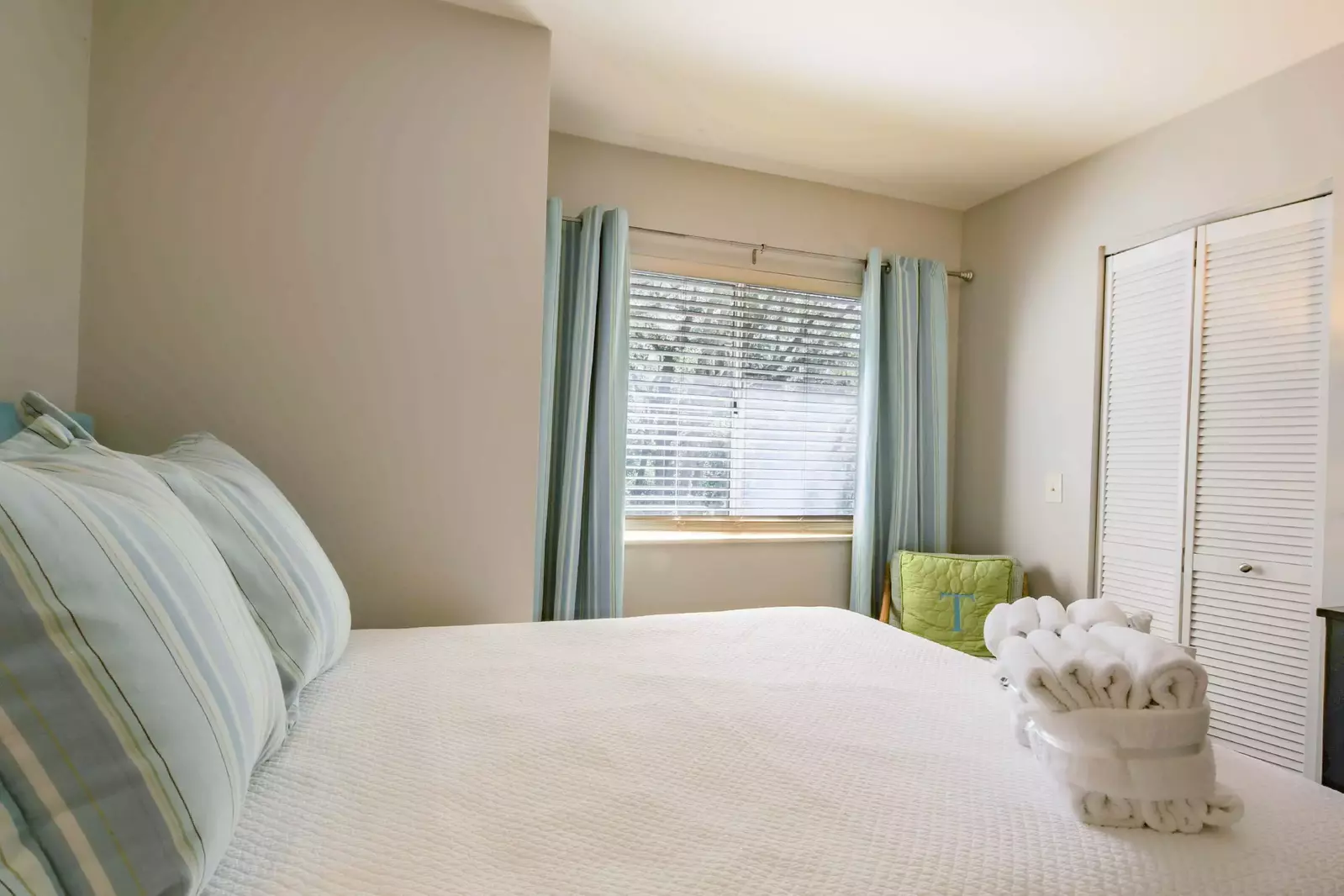The queen bedroom looks out onto the front side of the building.