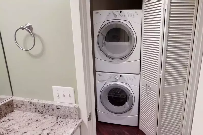 Laundry has stackable Washer/Dryer - Front Loading - High Efficiency