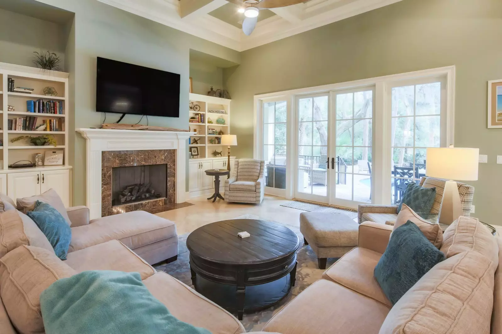 The living room opens onto the patio and backyard with private pool.