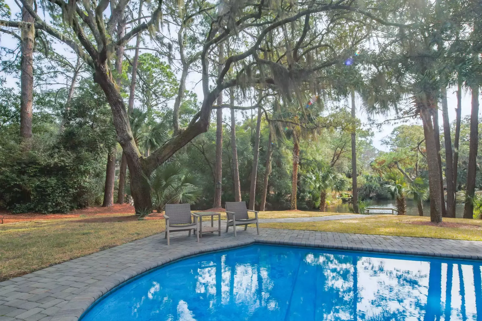The backyard is lined with the Lowcountry's finest - live oak trees, palmetto trees and pine trees.