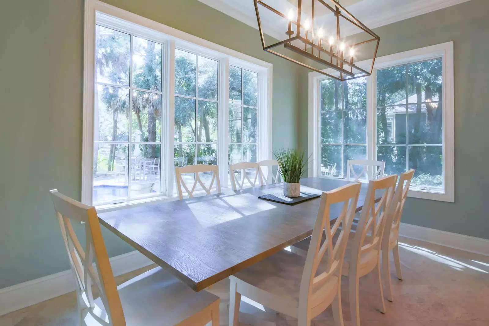 The dining table seats 8 and there is additional stool seating at the kitchen island.
