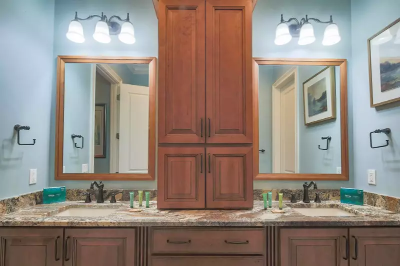 The en suite bathroom features a spacious, double sink vanity.