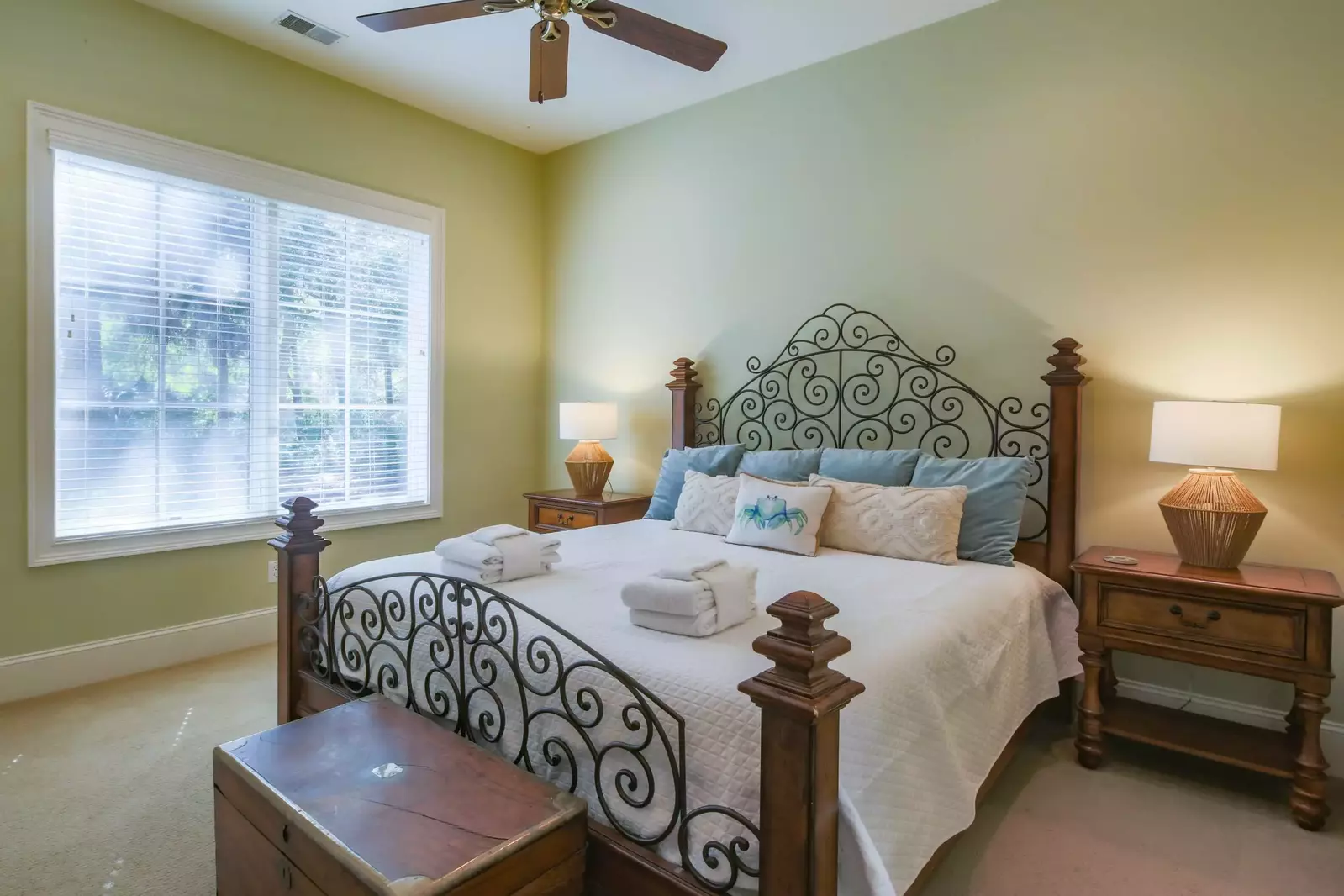 This king suite features a king bed and views of the backyard.
