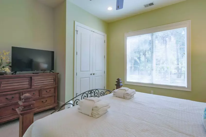 The king suite also has a dresser, TV and ceiling fan.