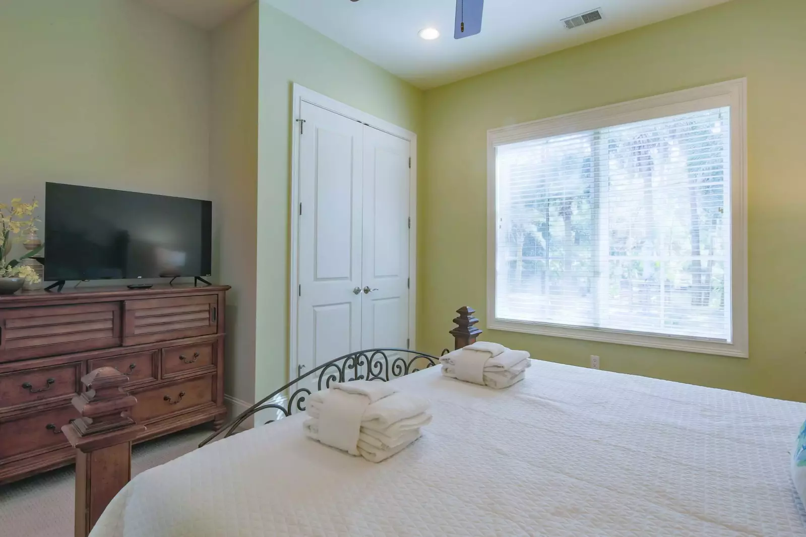 The king suite also has a dresser, TV and ceiling fan.
