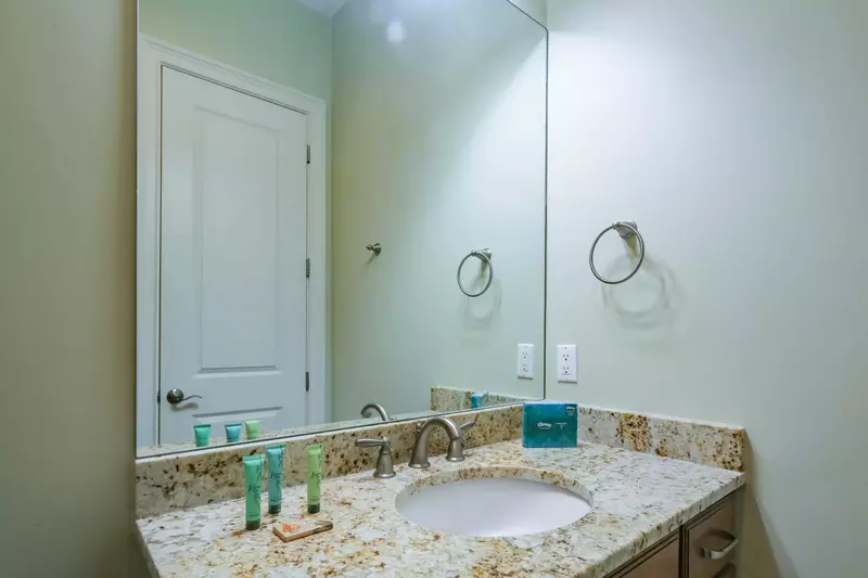 The en suite bathroom features a spacious vanity.