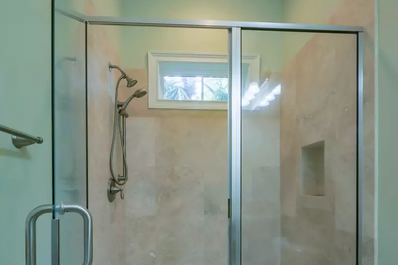 The en suite bathroom also has a tiled, walk-in shower.
