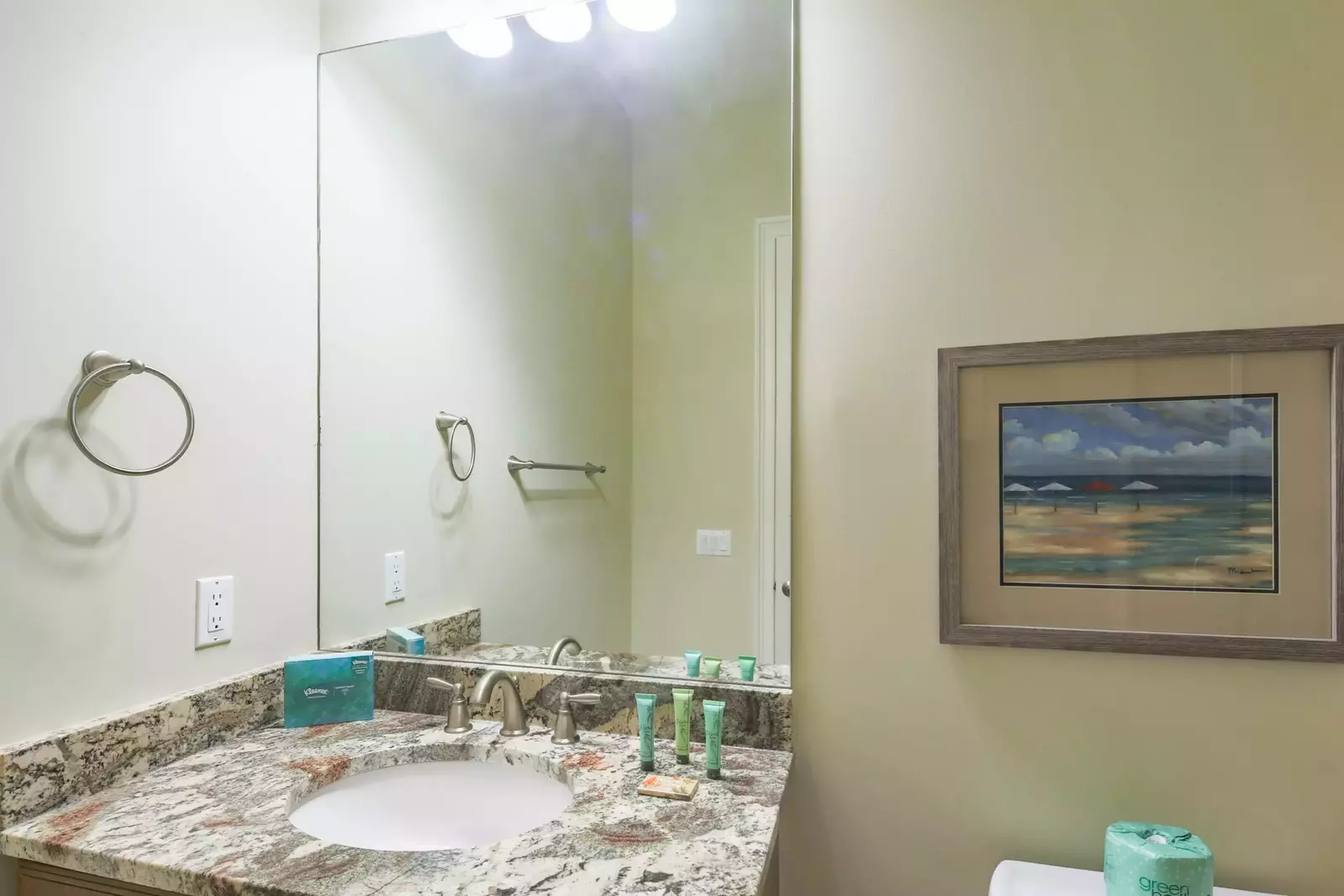 The en suite bathroom features a spacious vanity and a walk-in shower.