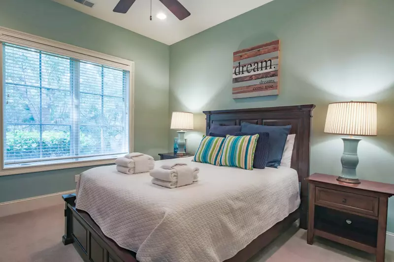 This guest bedroom features a queen bed.