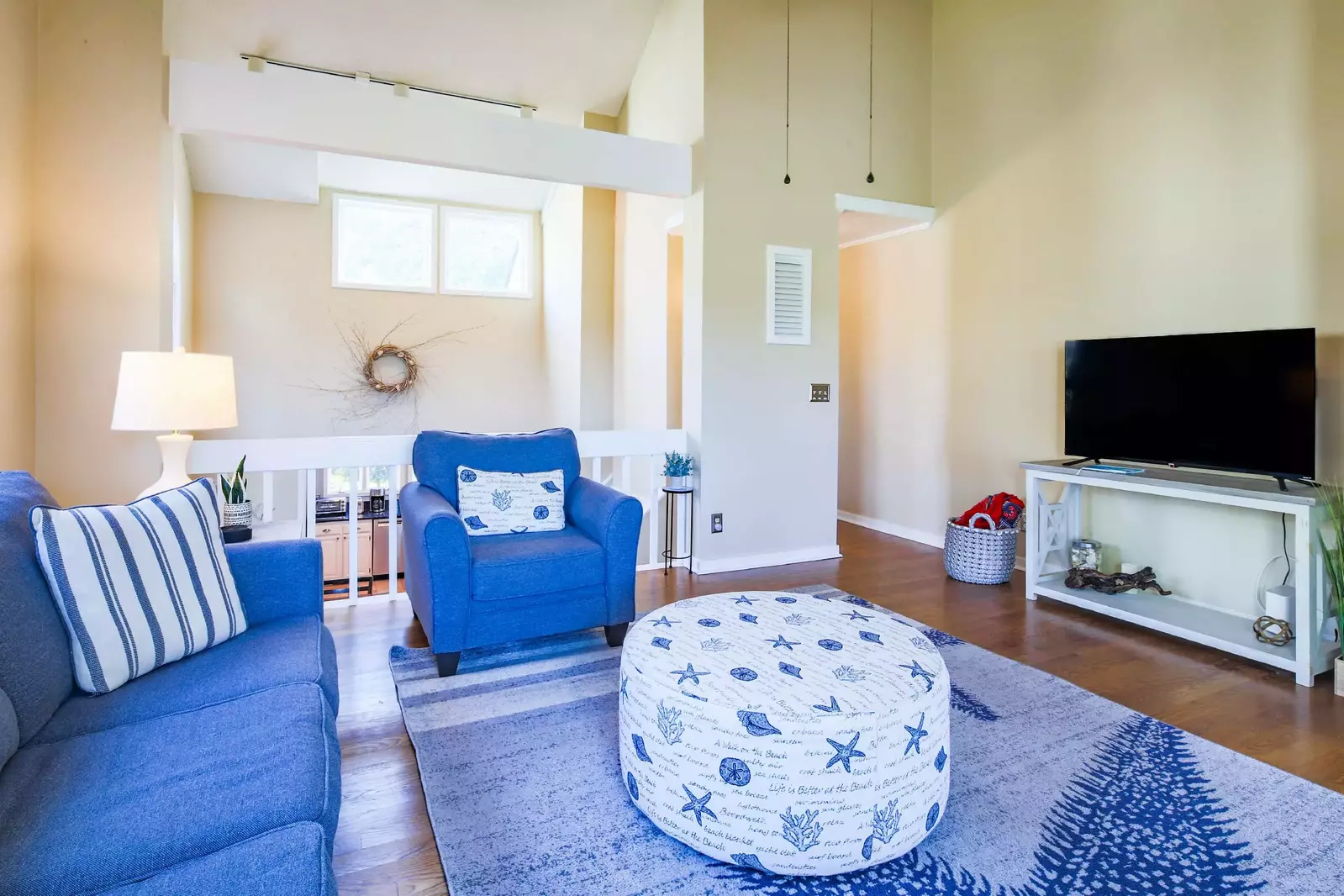 This balcony in the living room looks out onto the dining area and kitchen below.