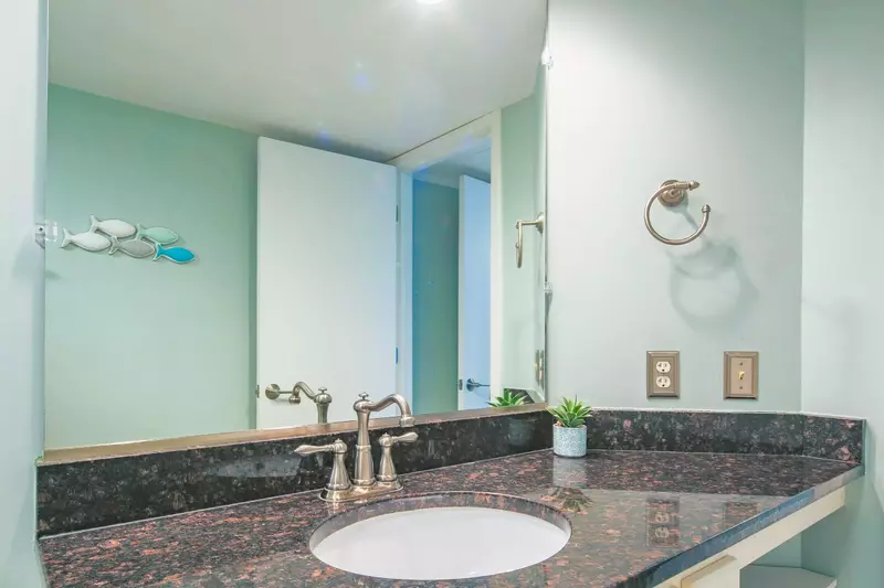 The en suite bathroom has a spacious vanity.