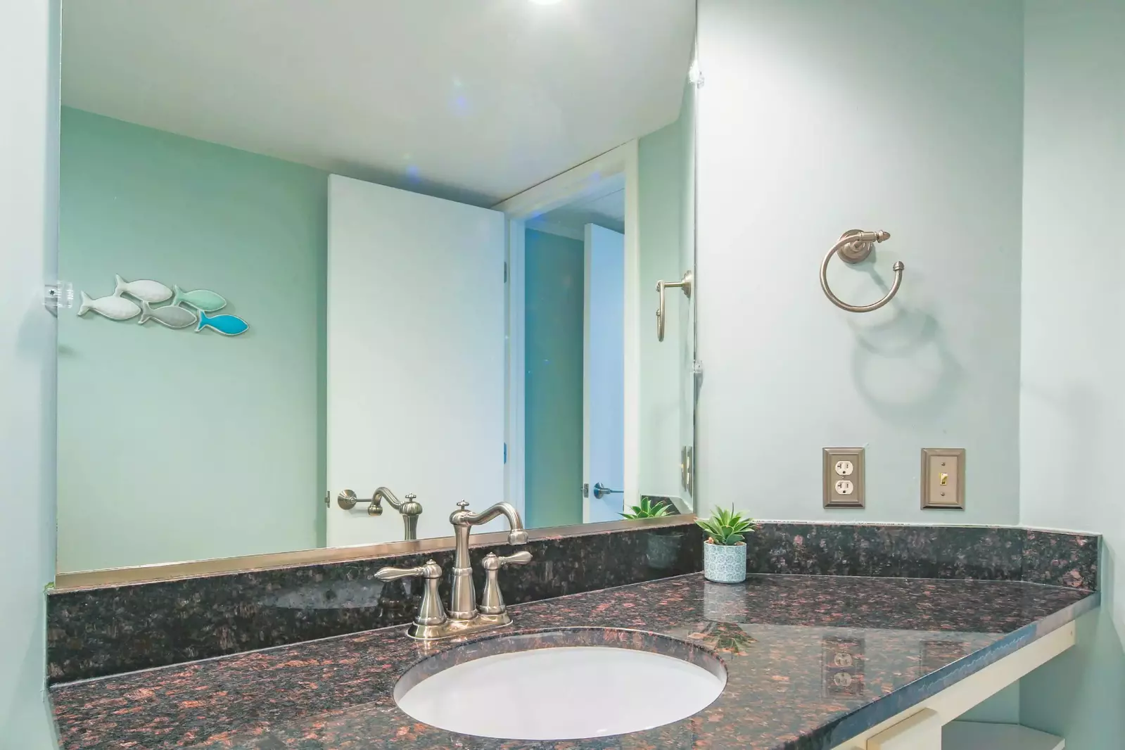 The en suite bathroom has a spacious vanity.