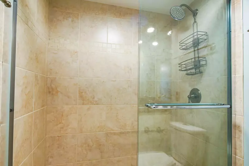 The en suite bathroom also has a tiled, walk-in shower.