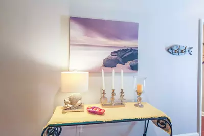 When you enter the front door, you'll find an entryway that connects to the living room and kitchen.