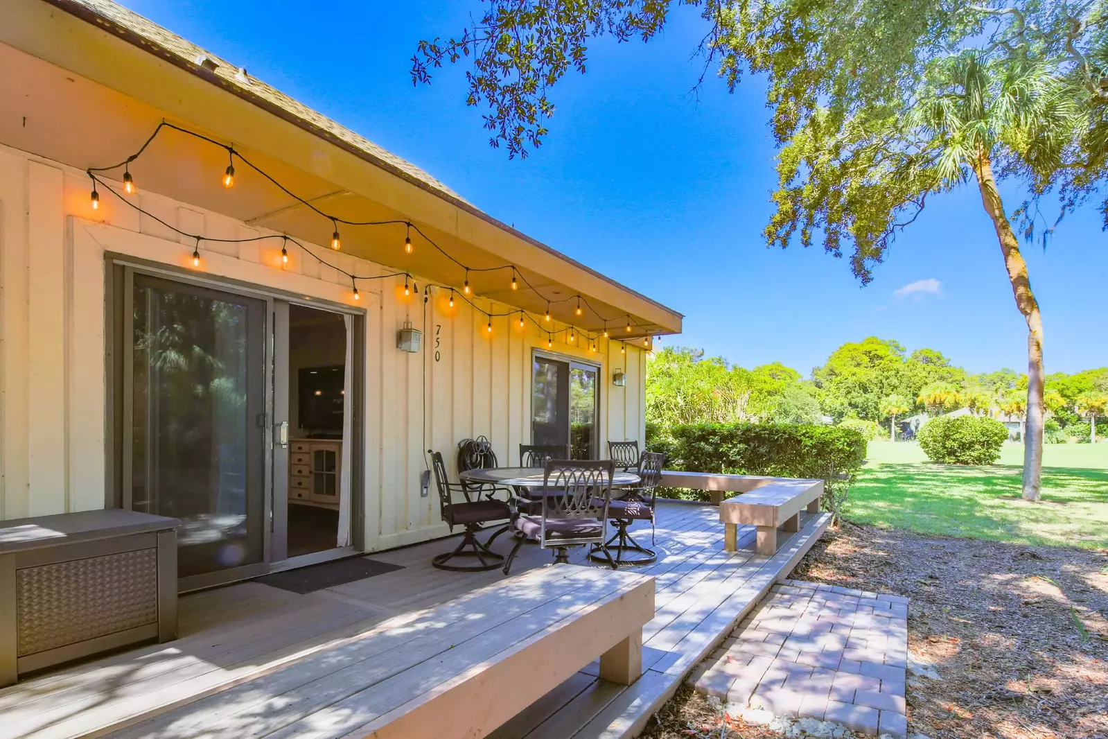 The back deck is accessible from both the living room and primary suite.
