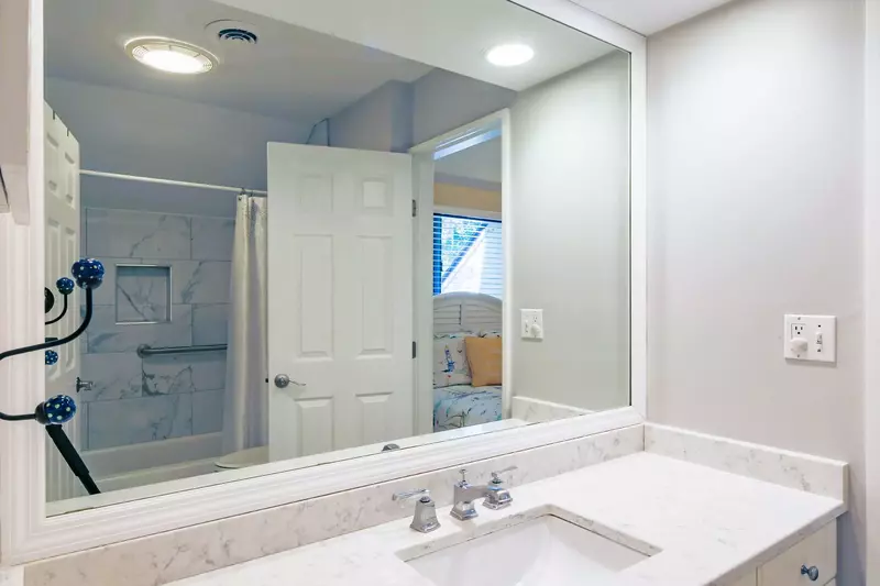 The jack & jill bathroom features a spacious vanity and a shower/tub combo.