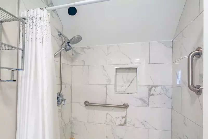 The shower/tub combo has two shower heads.