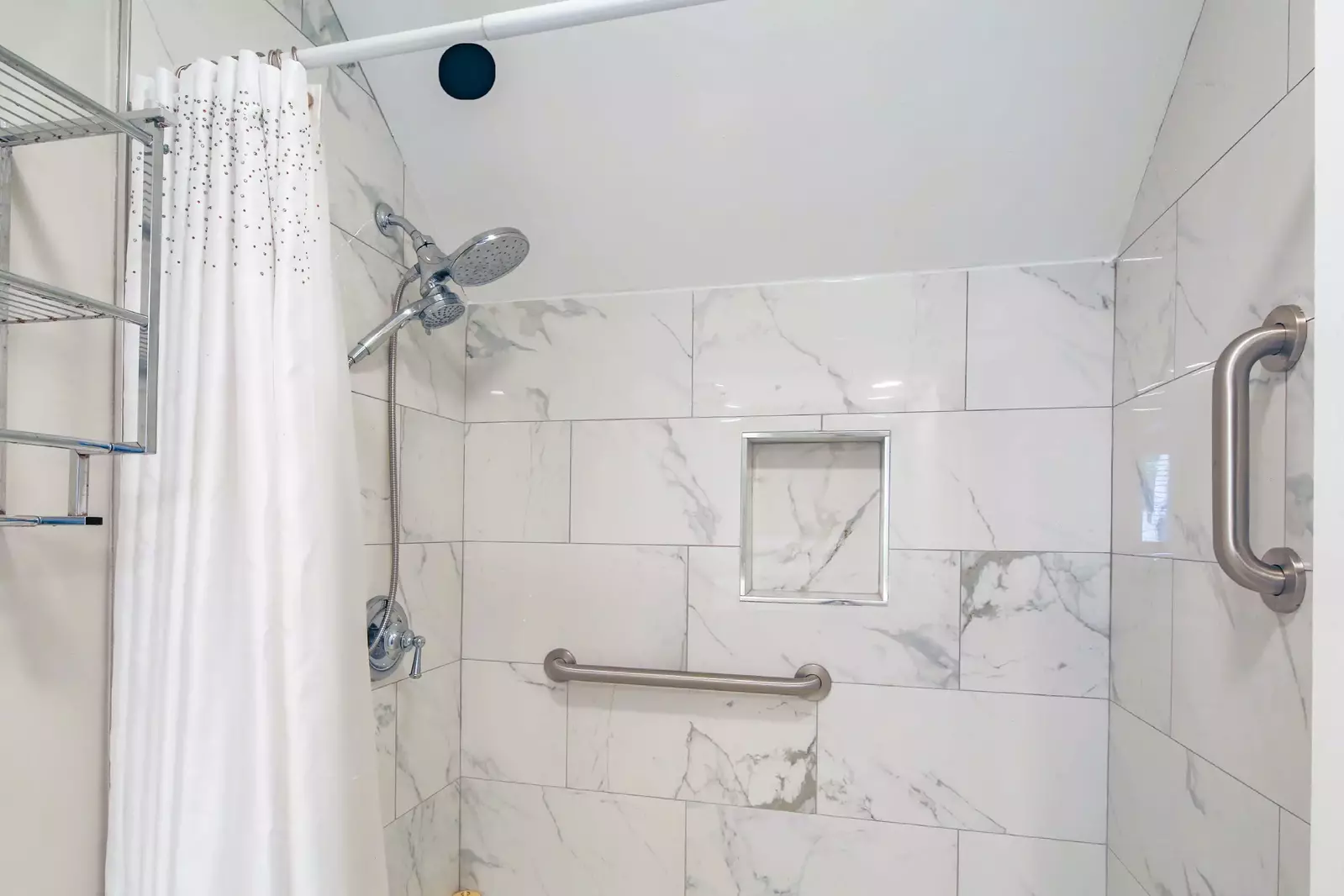 The shower/tub combo has two shower heads.