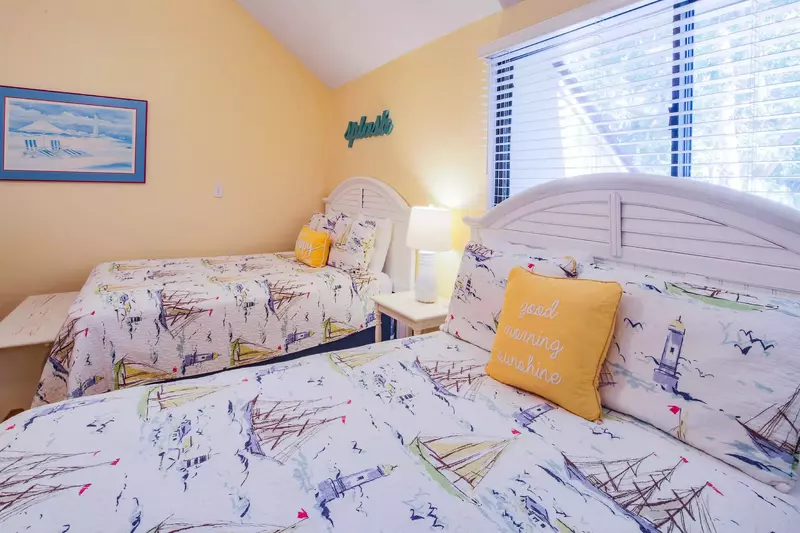 The full bedroom features two full beds.