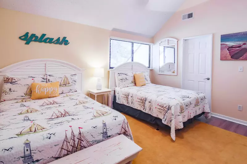 The full bedroom also features a bench, night stand with reading lamp and a mirror.