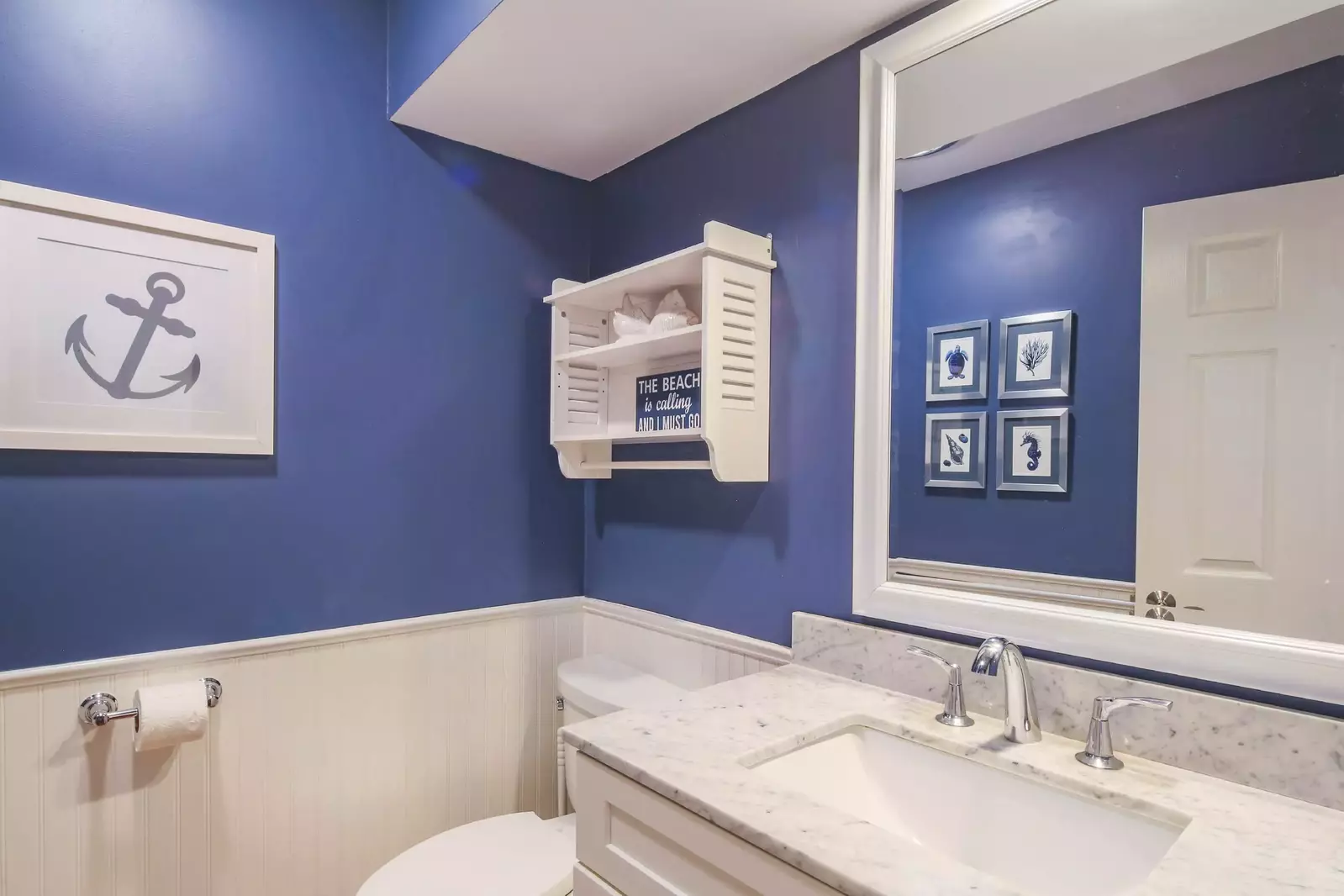 This half bathroom is located on the lower level near the living room and kitchen.