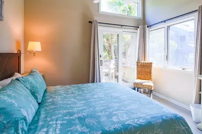 The bedroom also features sliding door access to the back deck.