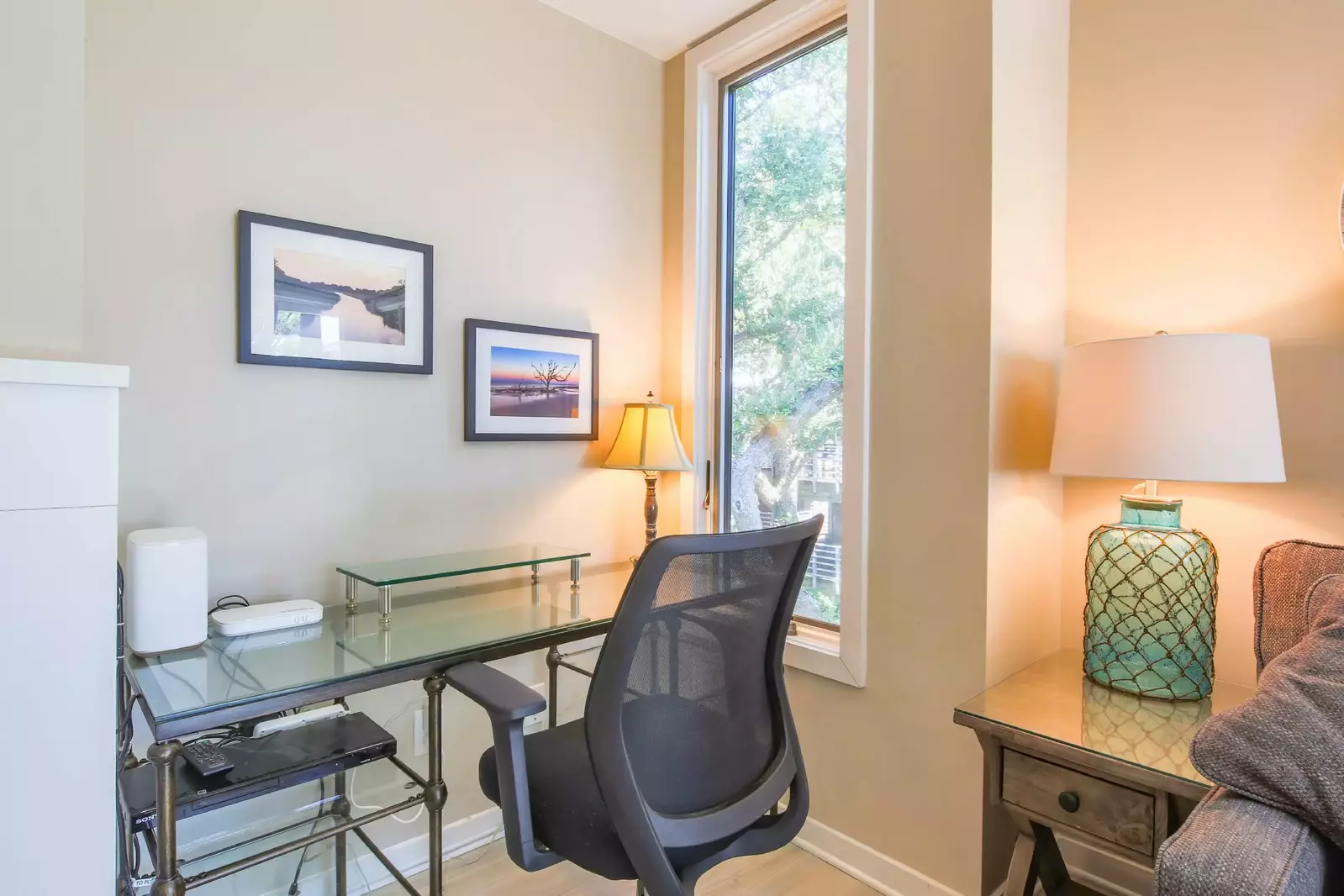 This desk is tucked away within the corner of the living room.