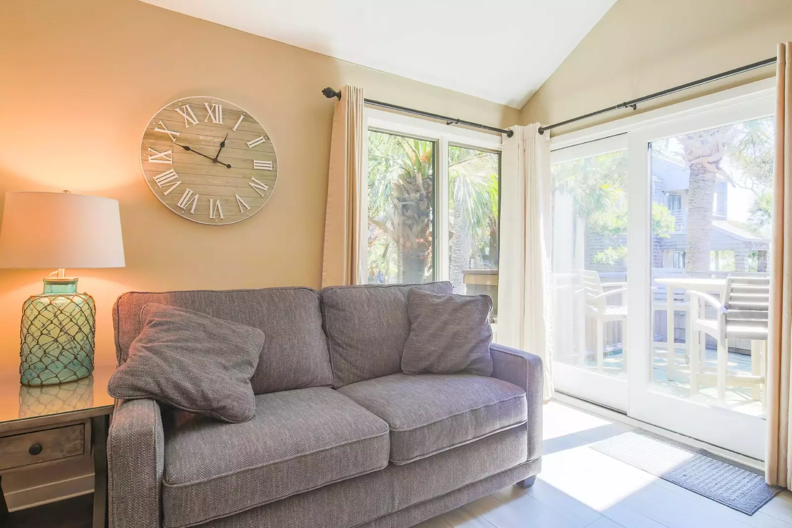 The sliding glass doors in the living room lead to the private back deck.