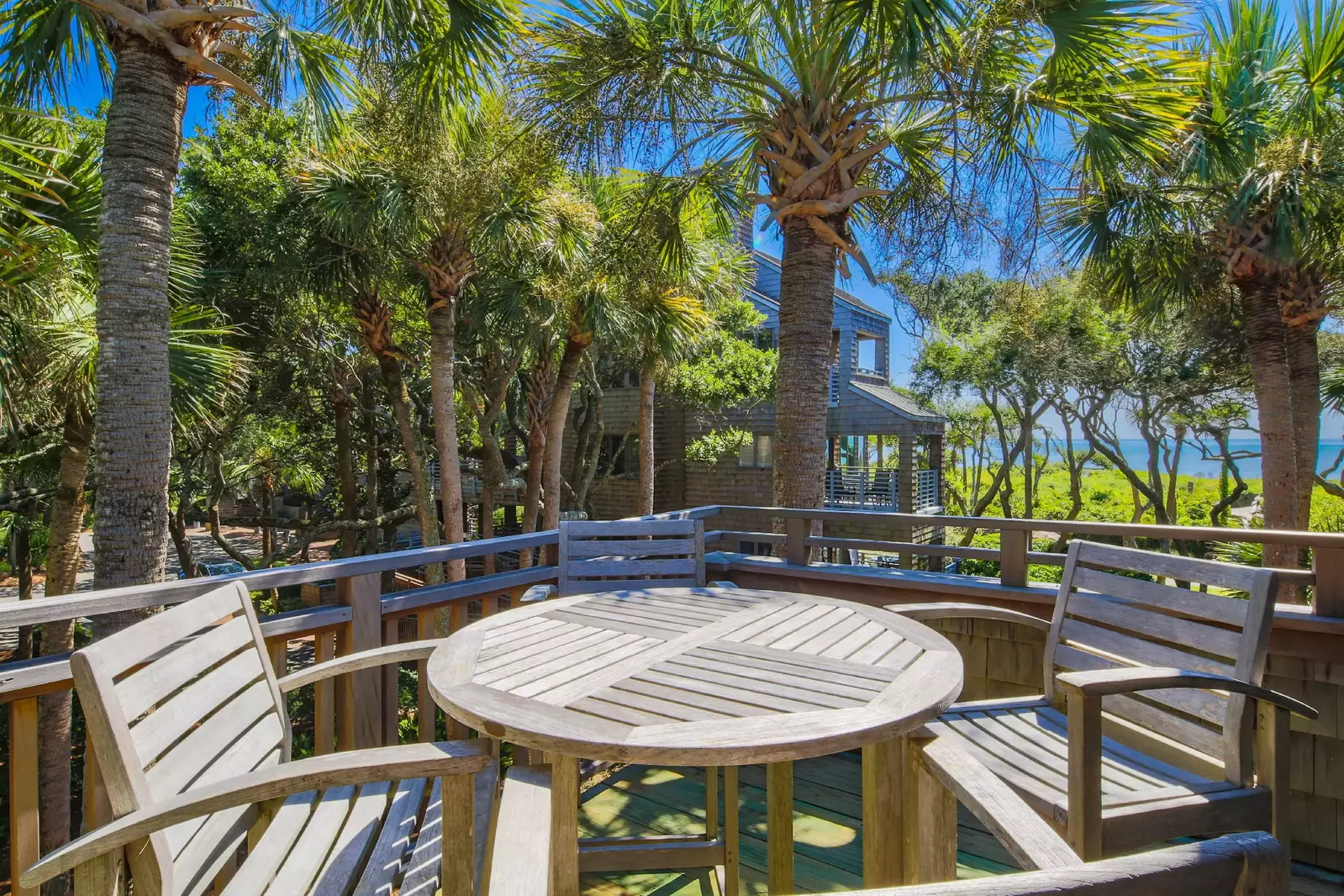 Step out onto the private back deck to find this incredible view and a teak high top table with chairs.