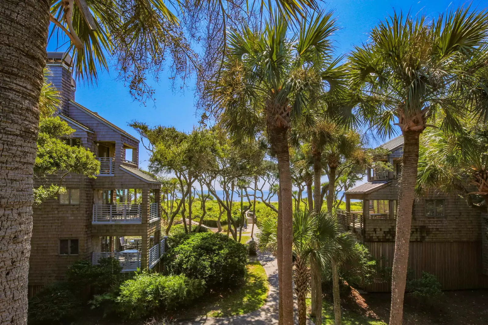 Take in this gorgeous, treelined view of the ocean from the bedroom, living room and back deck.