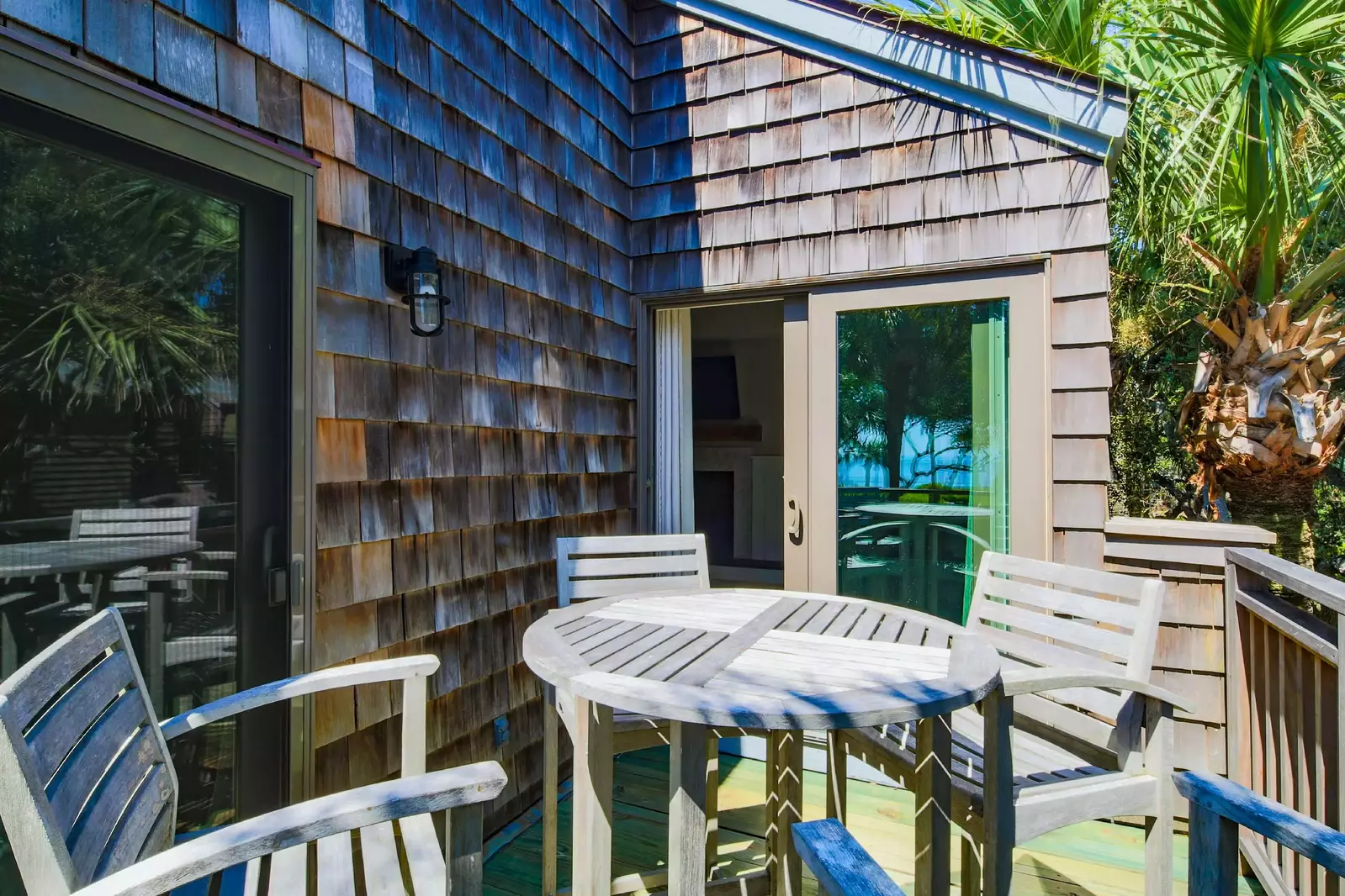 The back deck is accessible from both the living room and bedroom.