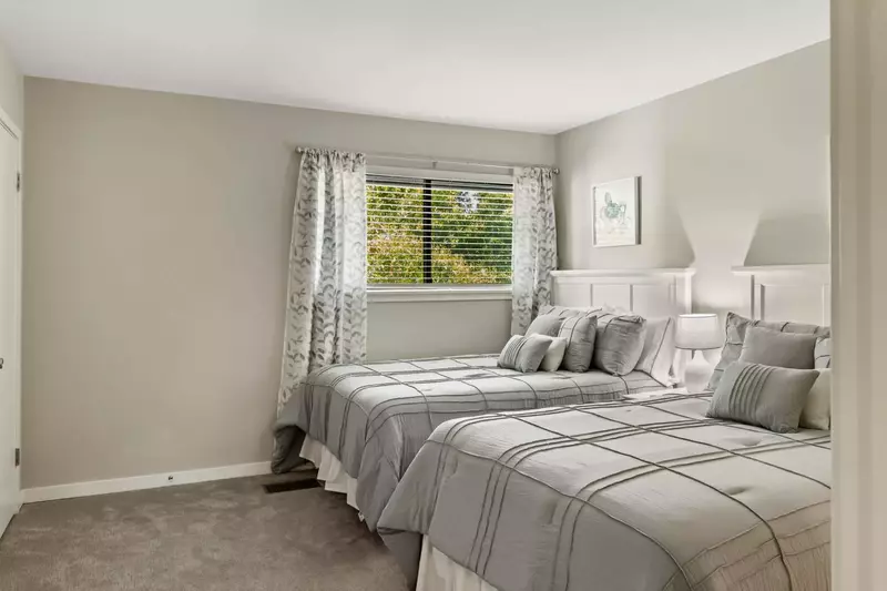 Two queen beds in guest bedroom