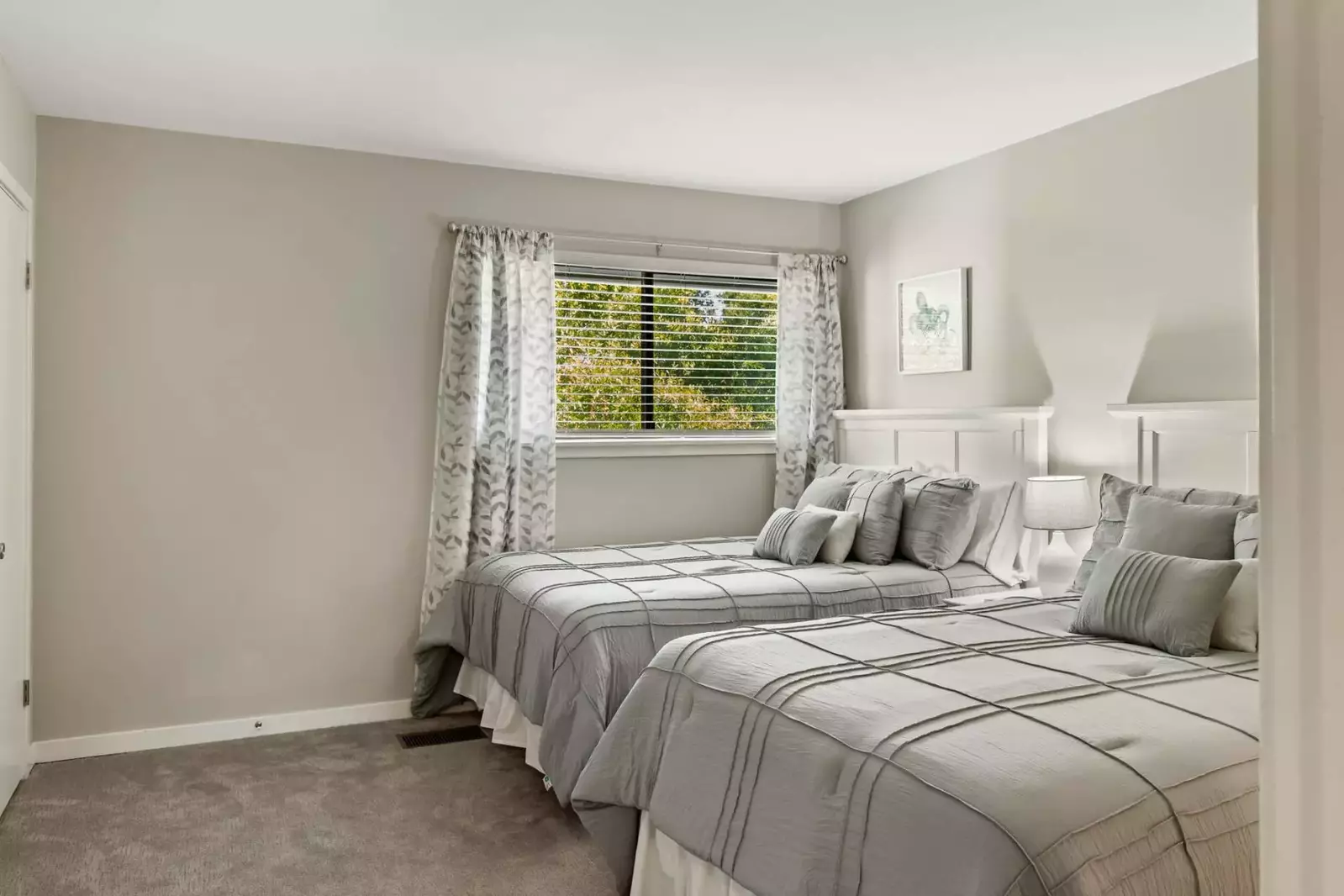 Two queen beds in guest bedroom