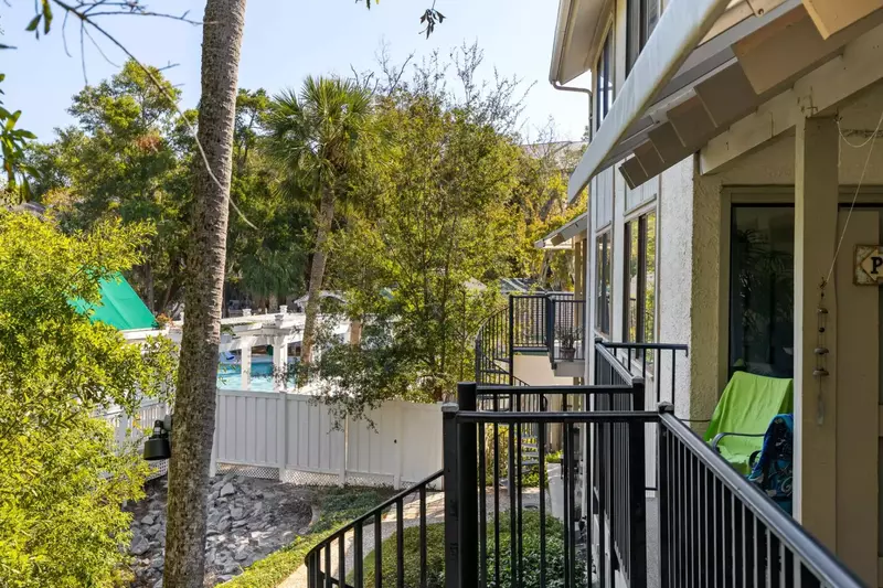 View from balcony. Spiral staircase leads to walkway to the pool
