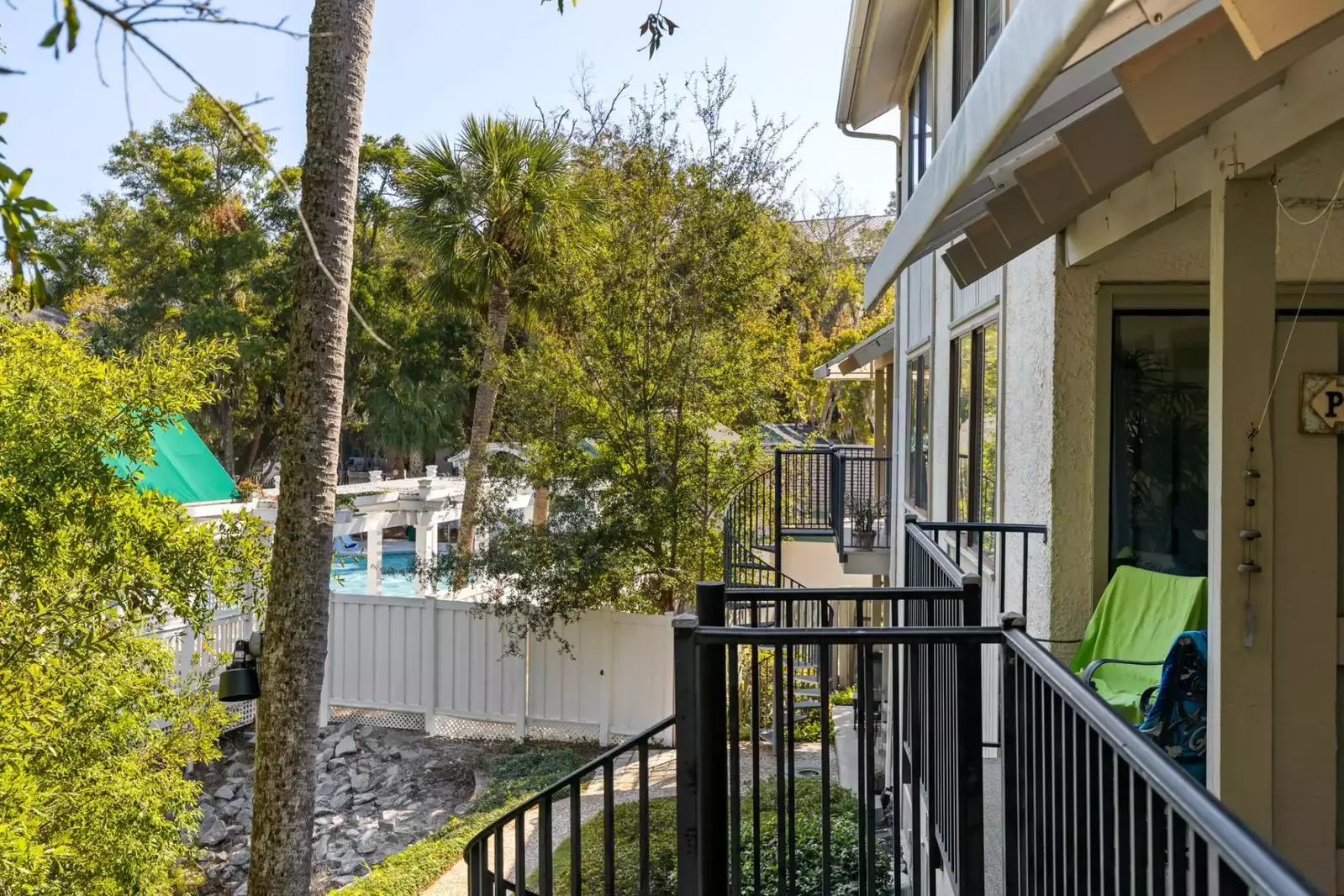 View from balcony. Spiral staircase leads to walkway to the pool