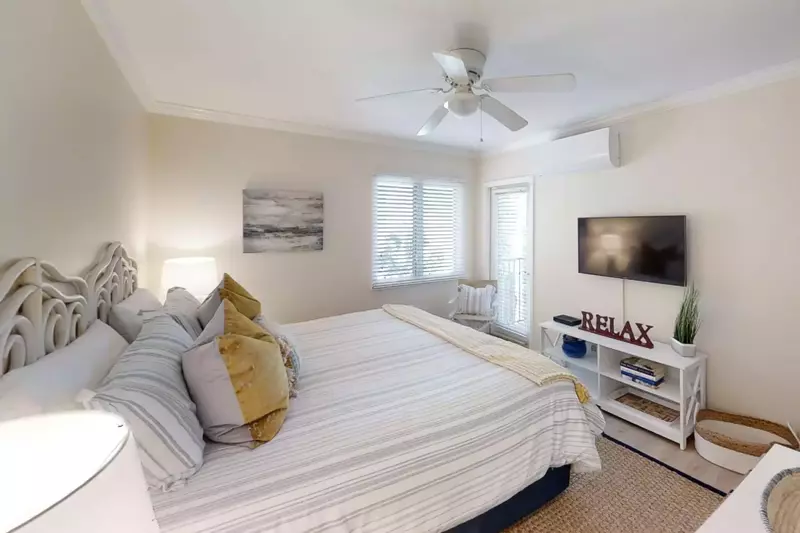 Primary bedroom with walkout to balcony