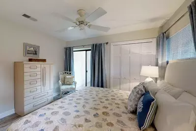 First Floor Master with doors leading to private patio