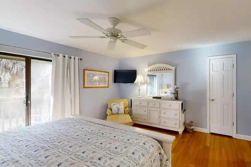 Master suite with sliding doors out to private second level balcony