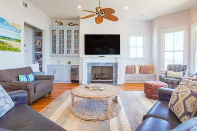 There is a wet bar and ice maker tucked away in the corner of the living room.