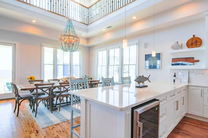 There are four kitchen stools situated alongside the kitchen counter.