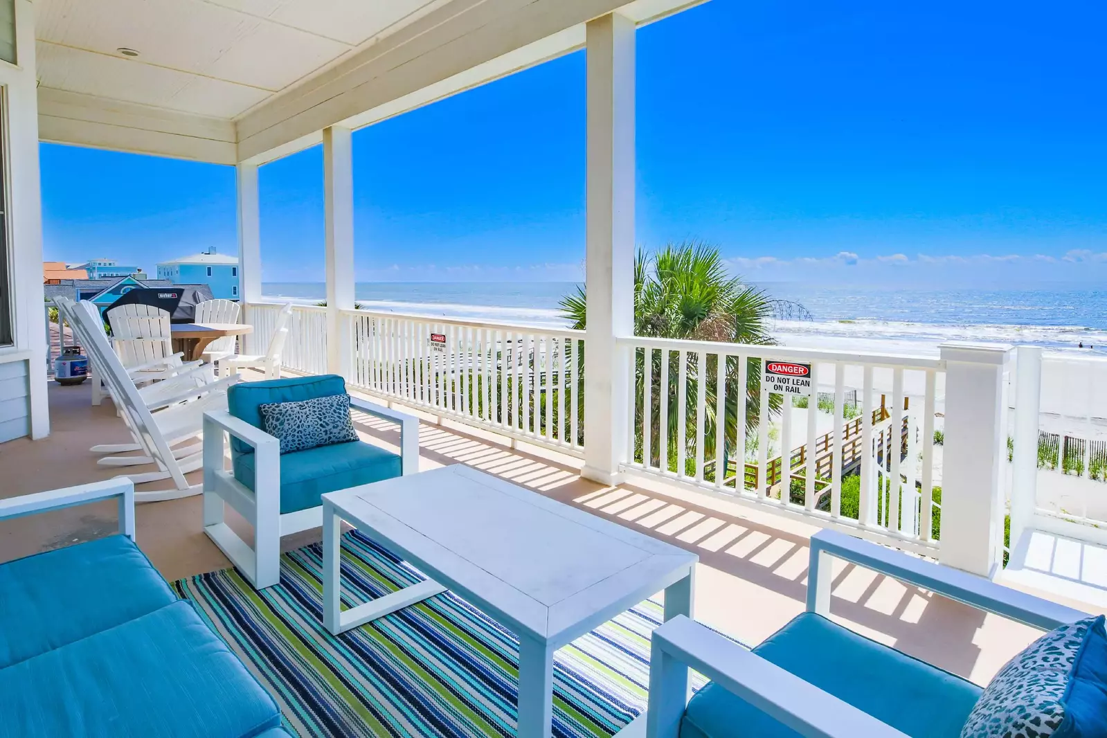 Soak up the incredible views from the covered deck off of the kitchen from the dining table, rocking chairs or seating area.