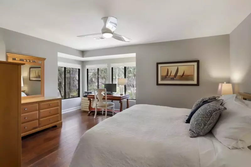 Master bedroom with natural light and comfortable surroundings