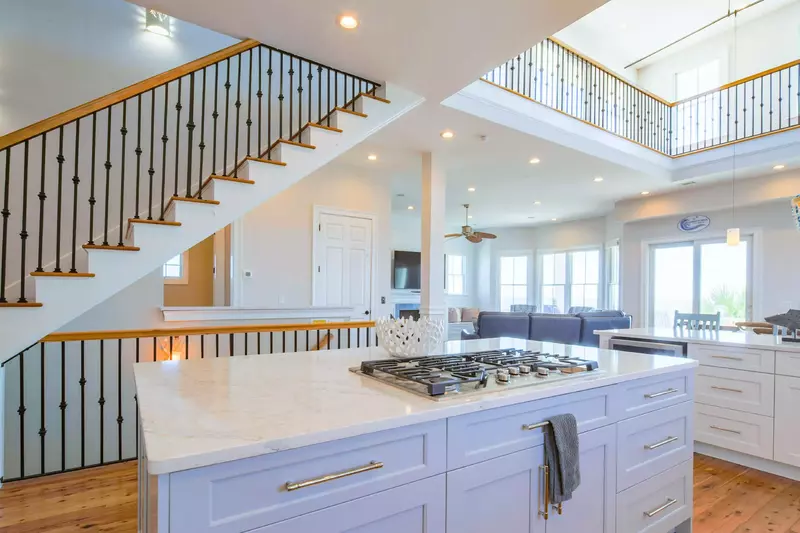 The staircase near the kitchen will take you to the third floor game room and roof deck.