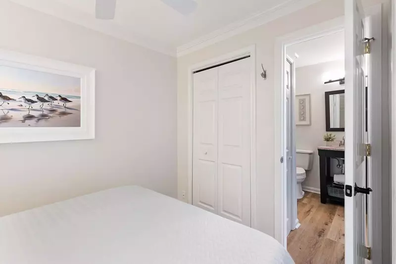 The bathroom is accessible from the bedroom and hallway