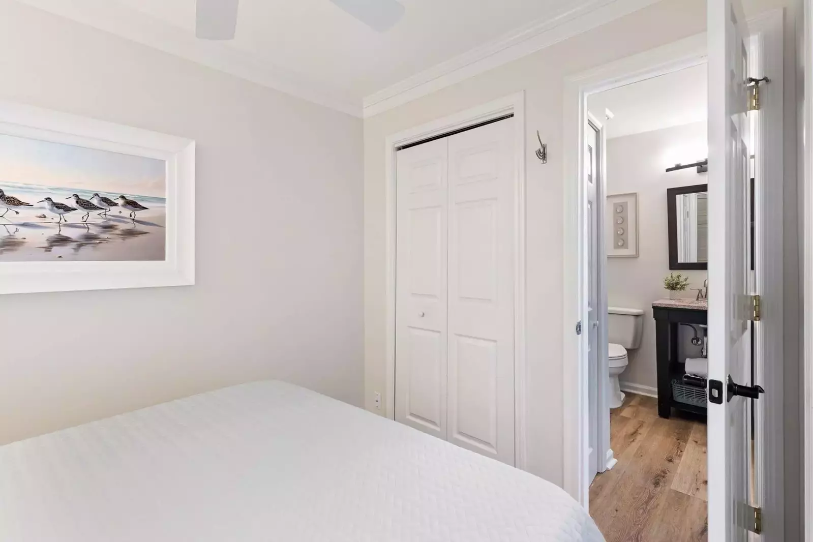 The bathroom is accessible from the bedroom and hallway