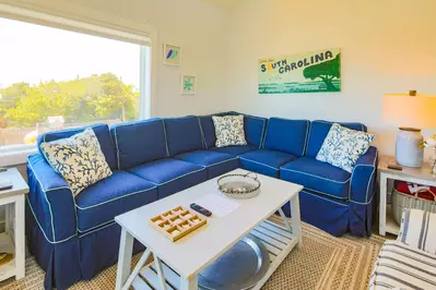 The living room features a spacious seating area.