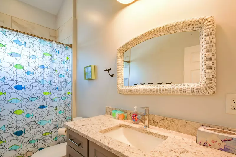 The guest bathroom features a spacious vanity.