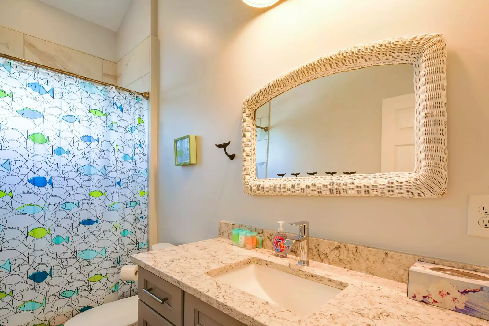 The guest bathroom features a spacious vanity.