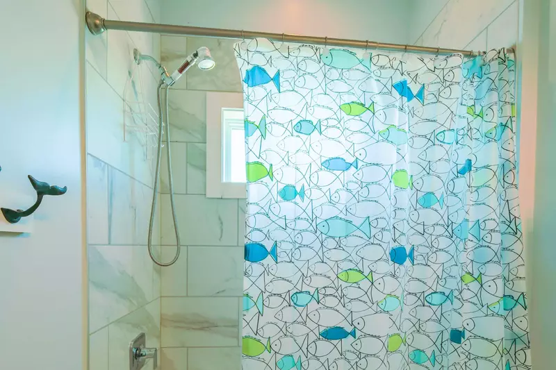 The guest bathroom also has a shower/tub combo.