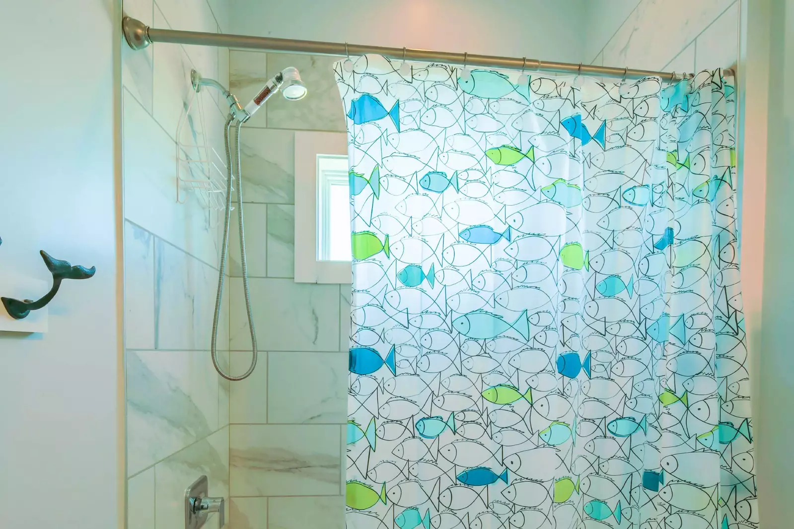 The guest bathroom also has a shower/tub combo.